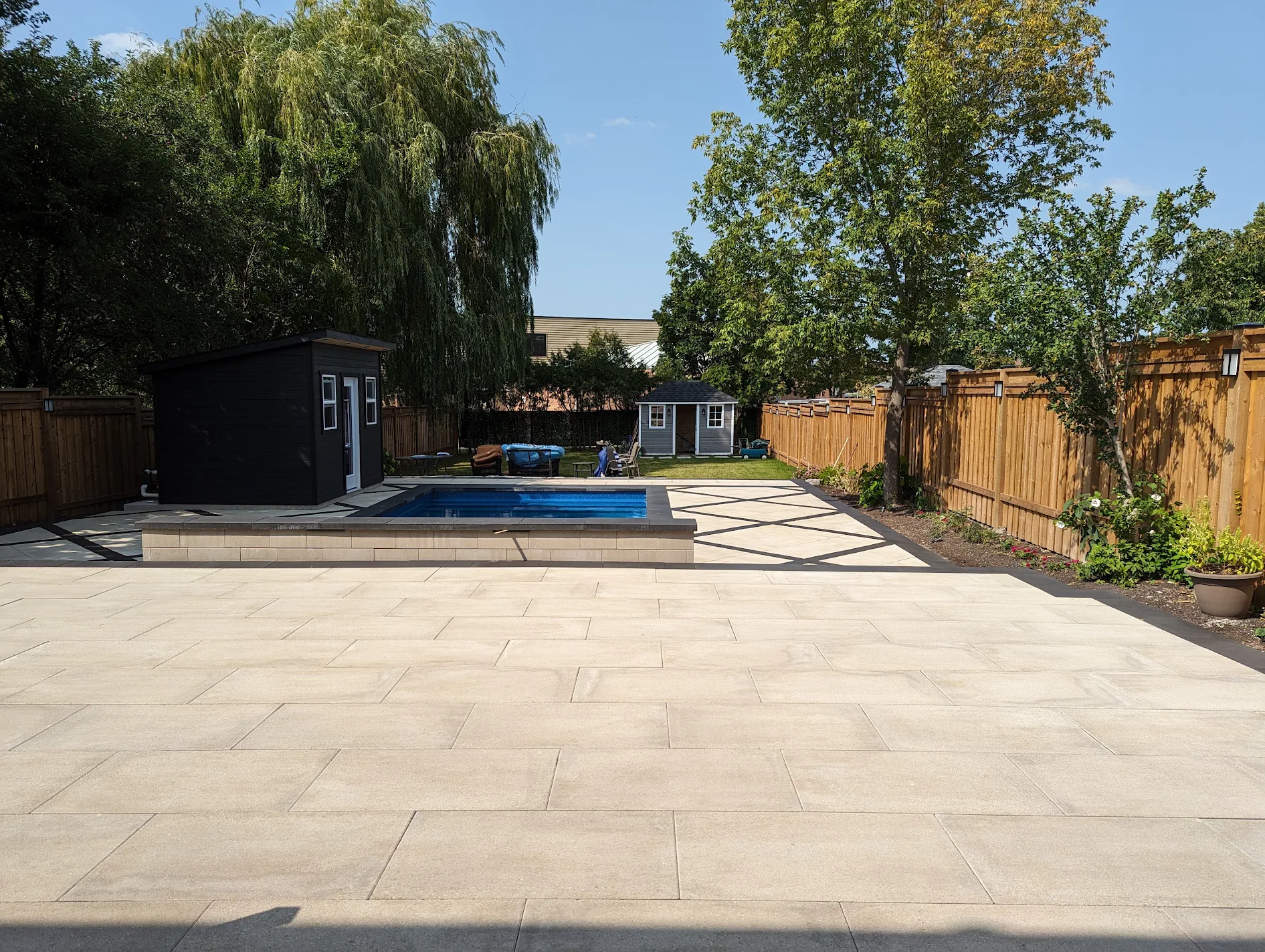 Custom inground pool with geometric patio pattern built by Land-Con in Toronto
